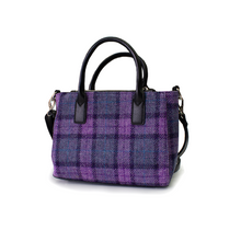 Harris Tweed is world renowned as the only hand-woven commercial cloth and is governed very carefully with their licences.  To have the Harris Tweed label is a privillage.  This handbag is available online and in-store from The Scottish Company, Toronto, 